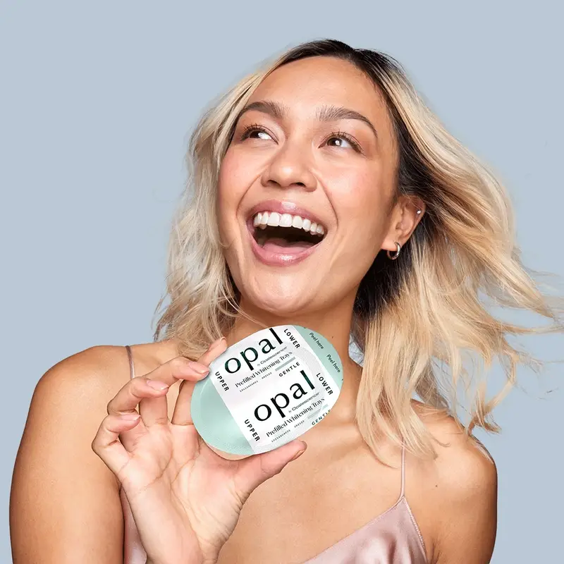 Smiling customer after teeth whitening session