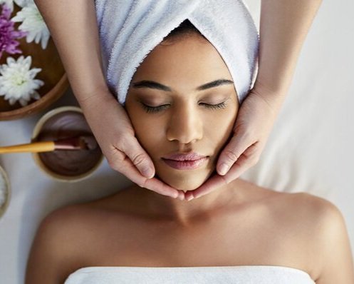 Client receiving a deep-cleansing facial treatment as part of the Rejuvenation Club membership