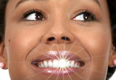 Smiling customer after teeth whitening session